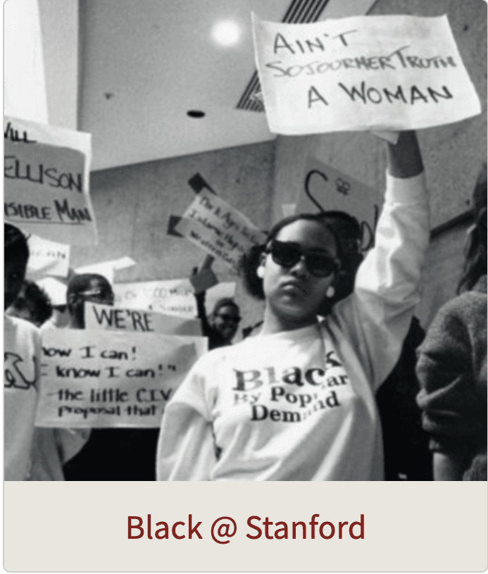 Black students holding fists in air and protest signs